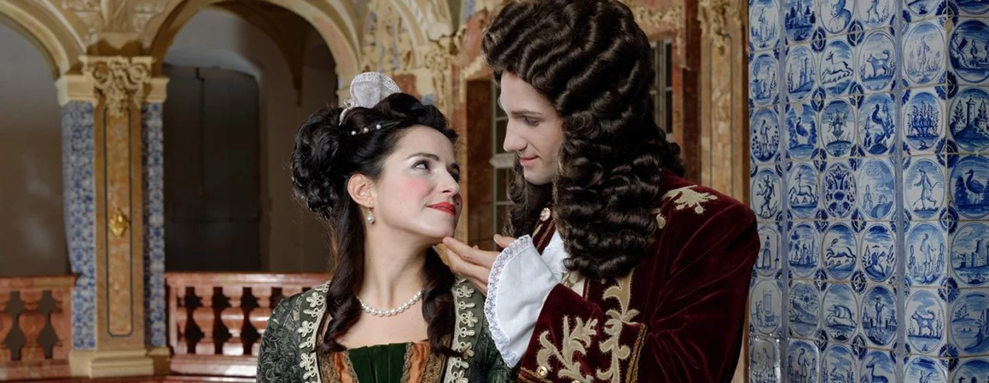 photo: Staatliche Schlösser und Gärten Baden-Württemberg, Niels Schubert Rastatt Favorite Palace, man and woman in costume in the Sala Terrena
